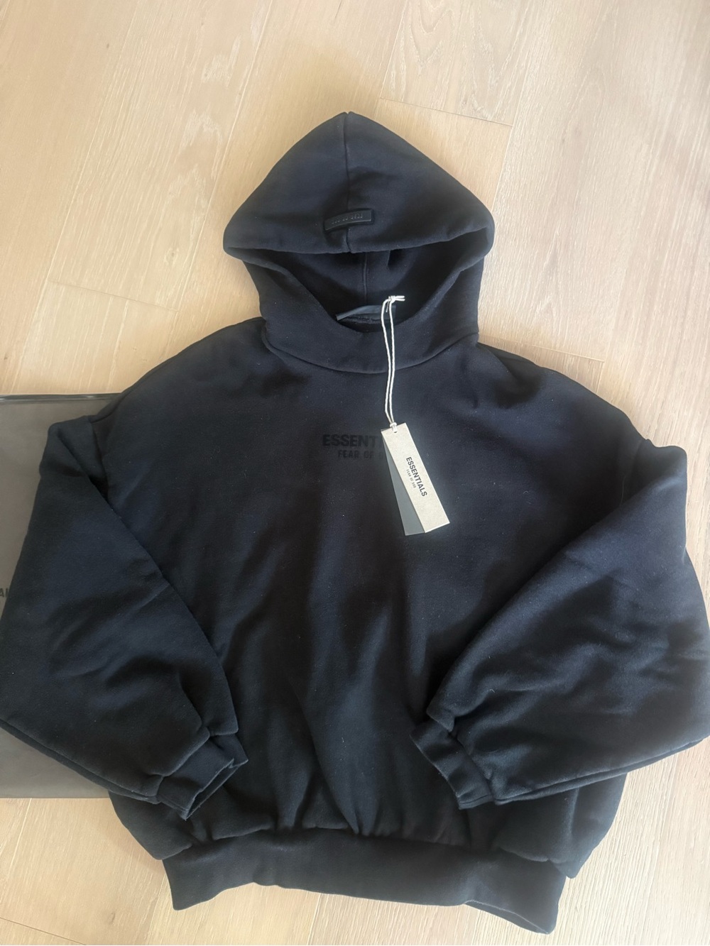 Essentials Black Pullover Hoodie with Subtle Chest Logo